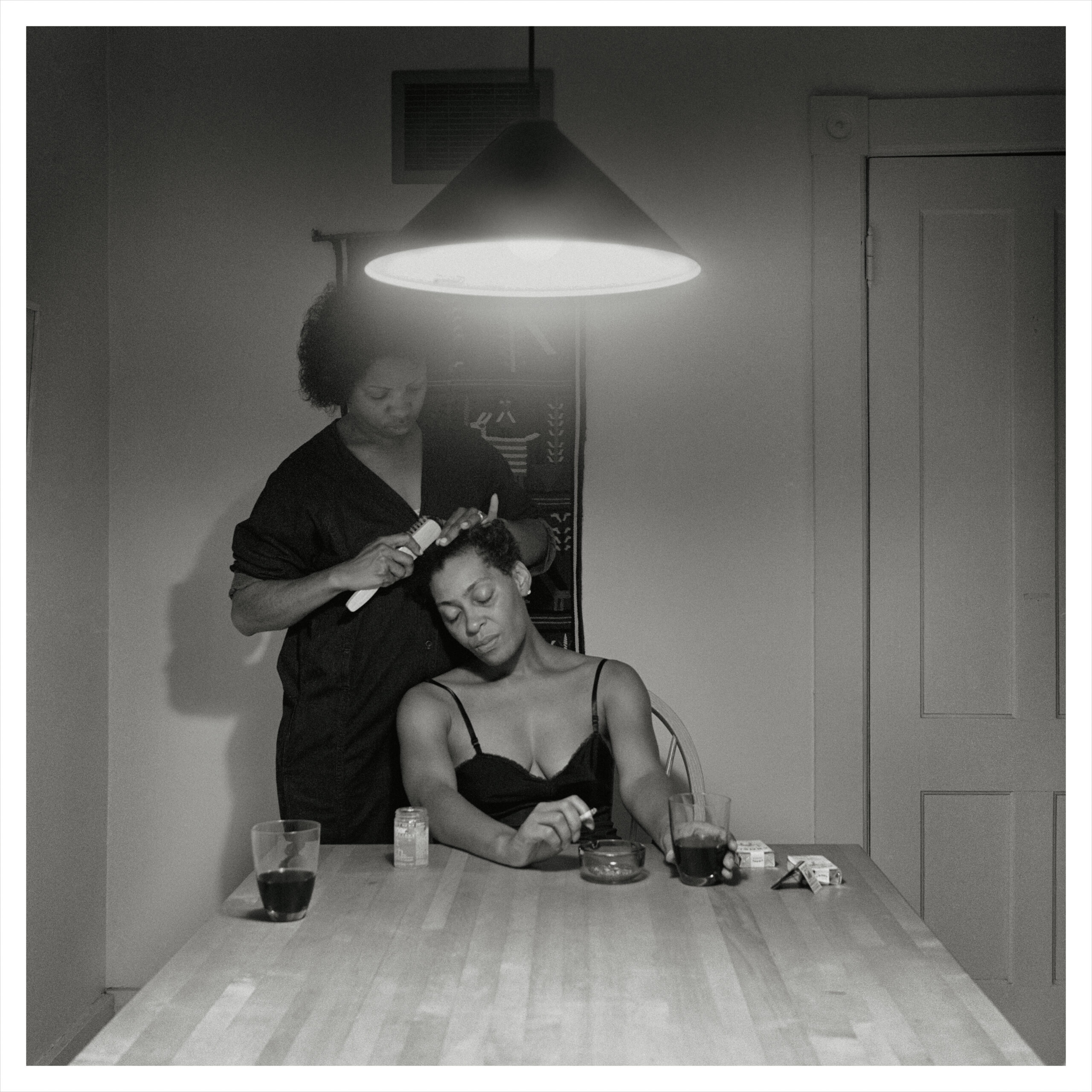 Untitled (Woman Brushing Hair) from the series Kitchen Table Series, 1990